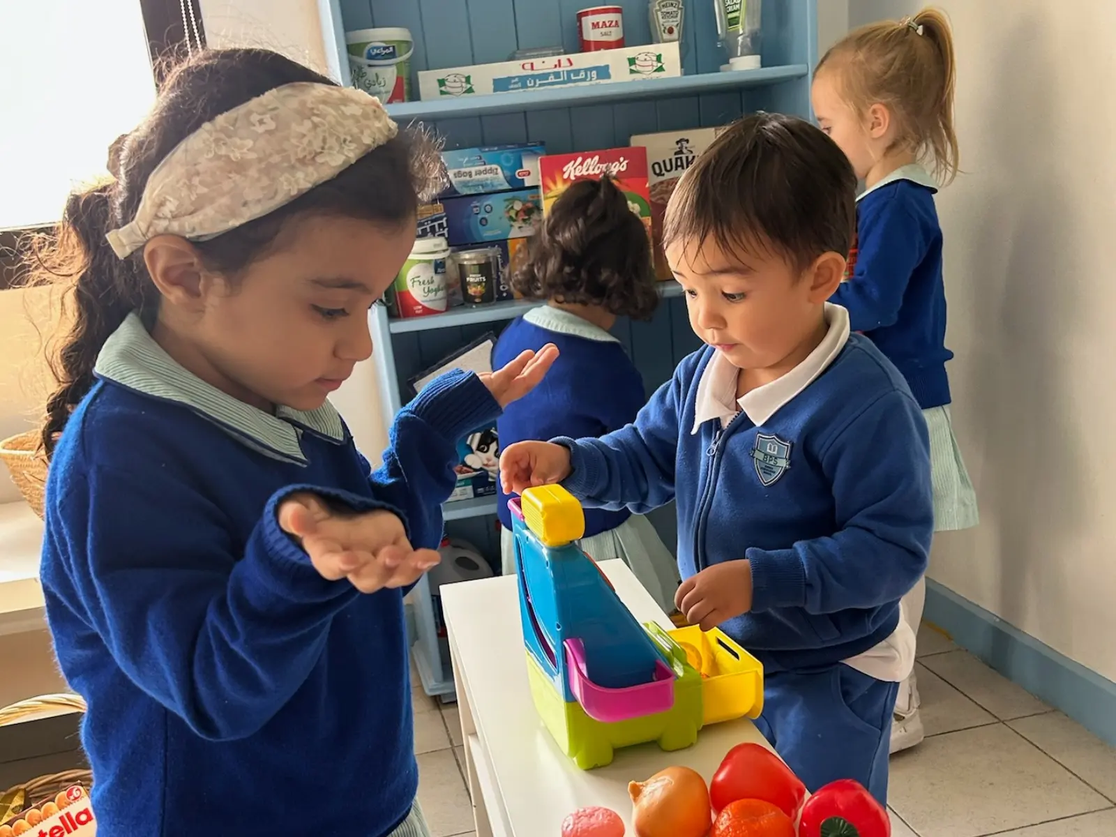 Children at a BPS after school club playing in the role play shop