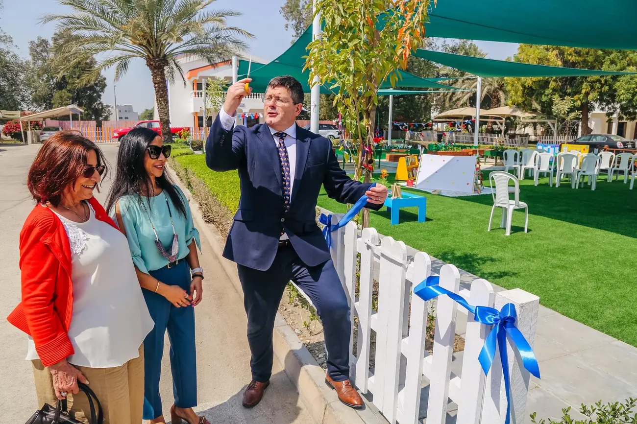 British Ambassador Roddy Drummond cutting the ribbon to open the BPS Teaching Garden in March 2022